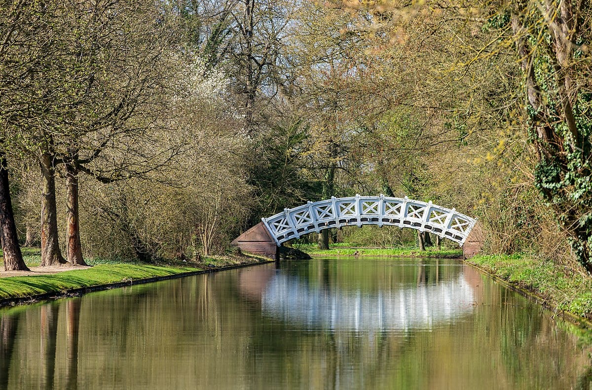 Schwetzingen, Germany, Schwetzingen Castle gardens: The so-called Chinese bridge or Palladio bridge, seen from east by north-east over the canal. The sparse greenery shows that it is spring.